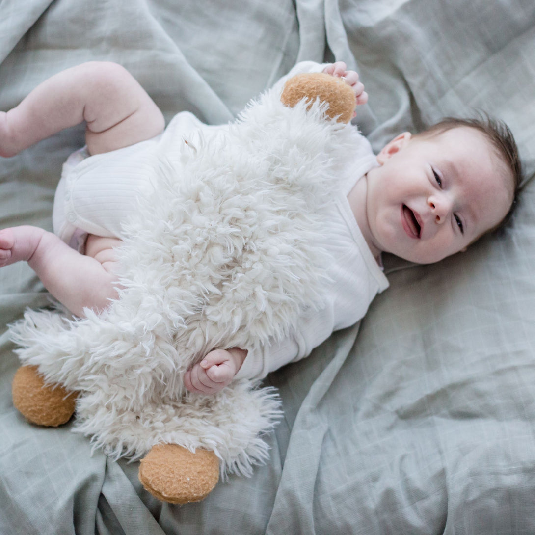 Baby wearing Muslin Swaddle Blanket