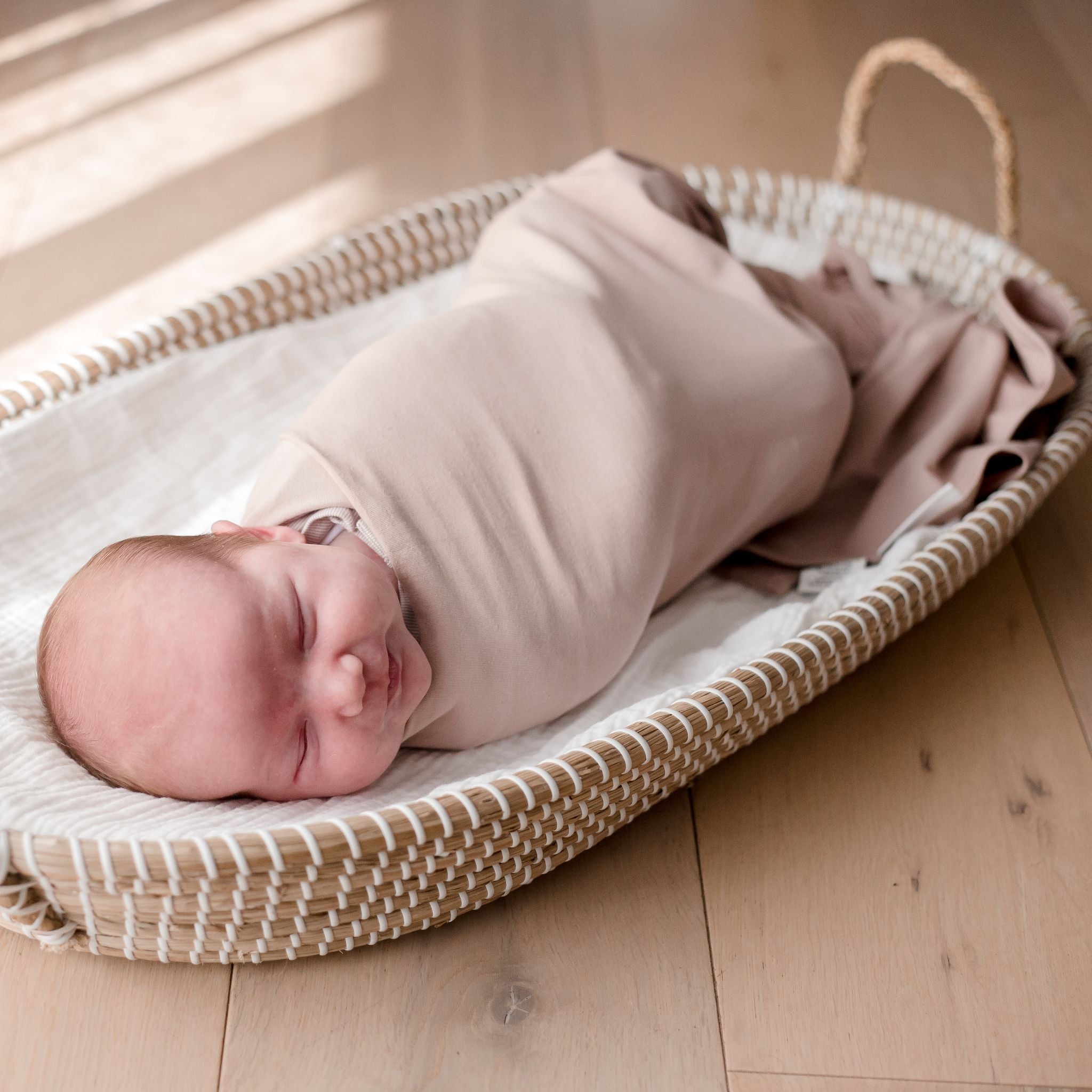 Baby wearing Stretchy Swaddle baby Blanket | Sunset (Organic)