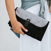 Women showing Nappy Change Mat Clutch | Gridlock Grey