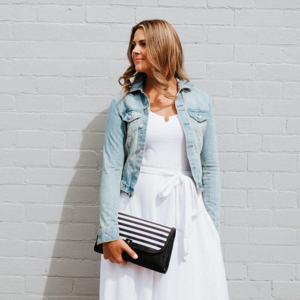 Women showing Nappy Change Mat Clutch | Zebra Crossing