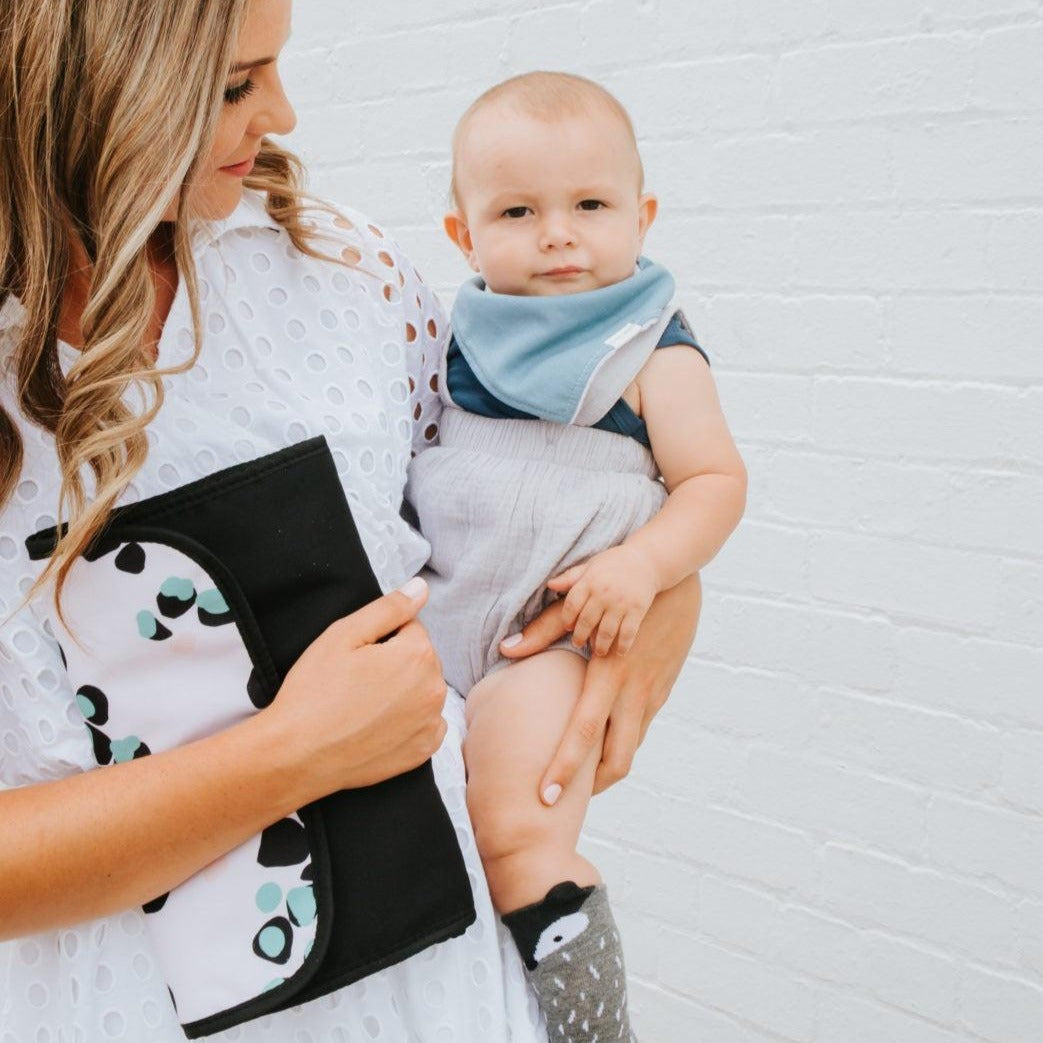 Women with her baby showing Nappy Change Mat Clutch | Just Peachy