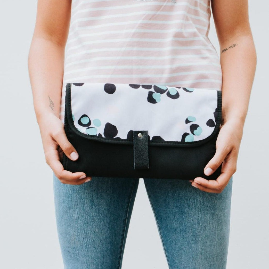 Women showing Nappy Change Mat Clutch | Just Peachy