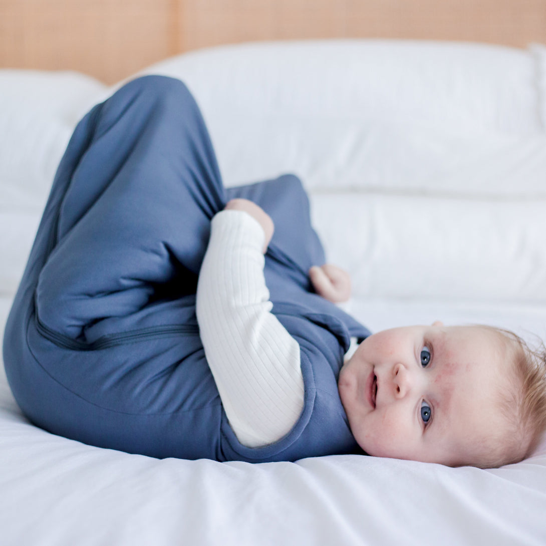Baby laying on bed in his Baby Sleeping Bag | Horizon-Zoesage