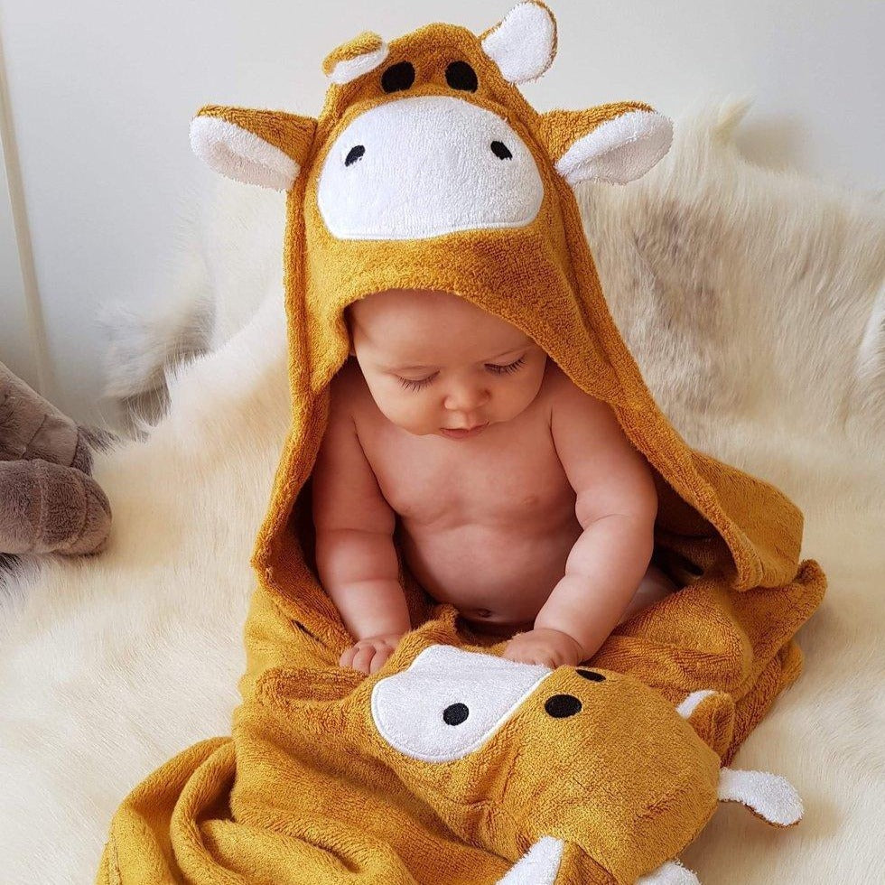 Baby wearing Giraffe Hooded Baby Towel & Mit in brown color