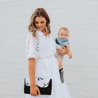 Women with her baby showing Nappy Change Mat Clutch | Just Peachy