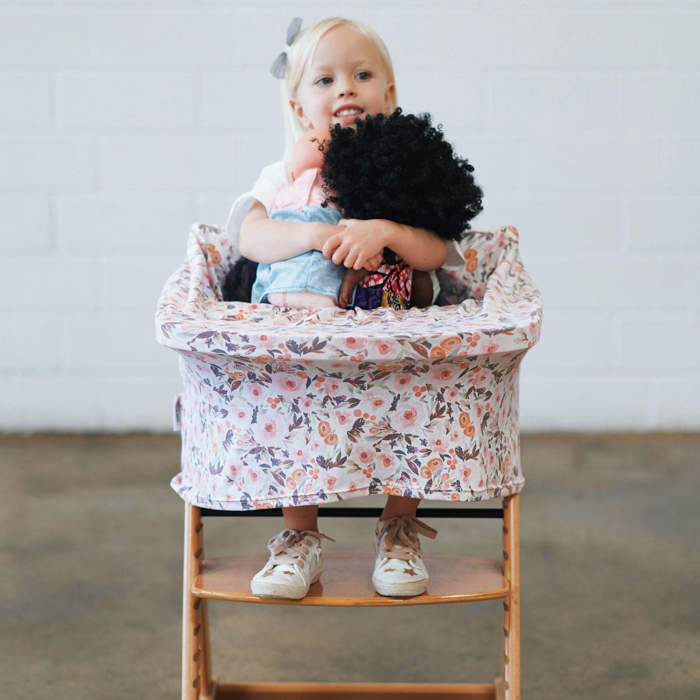 Girl sitting in 5 -1  Mama Cover chair