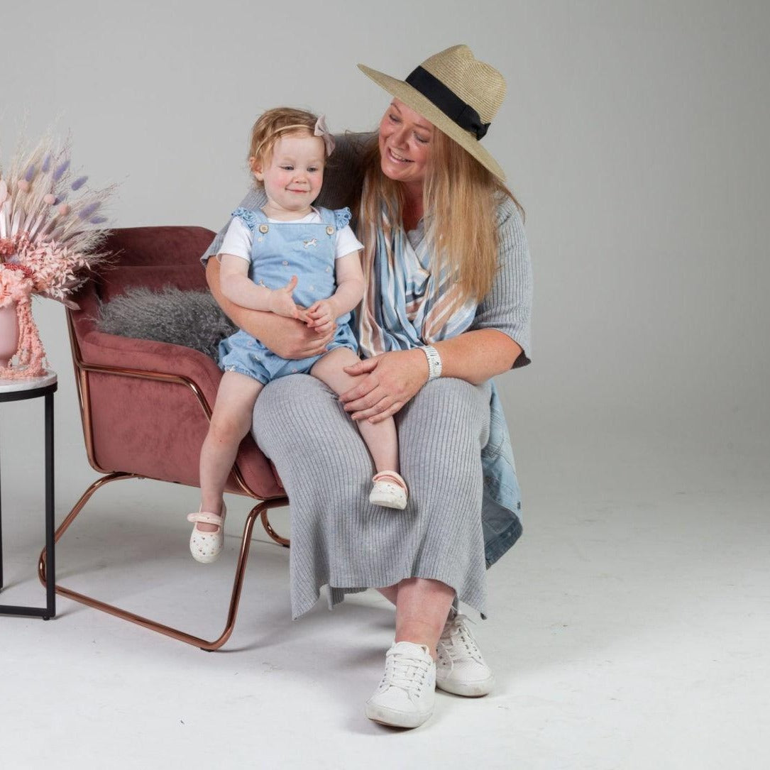 Women sitting with her baby on the sofa