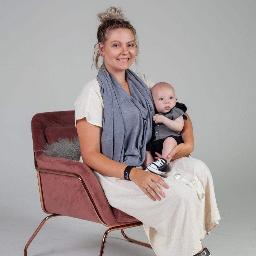 Women and her baby sitting on the chair