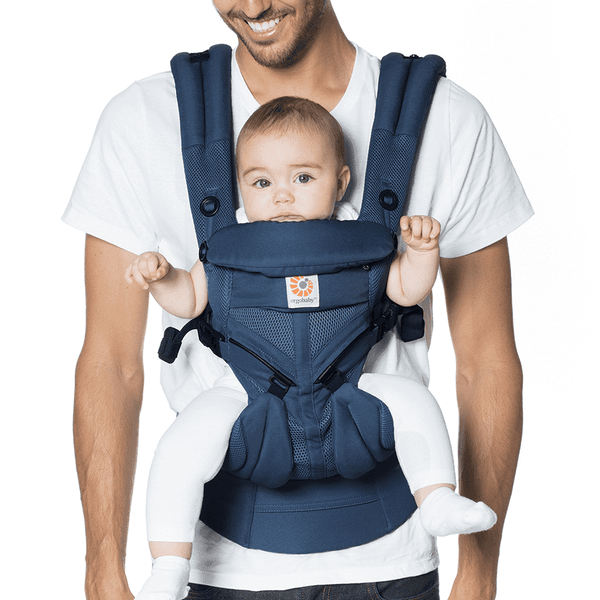  Man wearing Ergobaby All Position OMNI 360 Cool Air Mesh Baby Carrier with his baby inside it